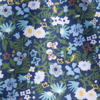 Little English traditional children's clothing. Blue, navy, and green Winslow Floral knit fabric swatch