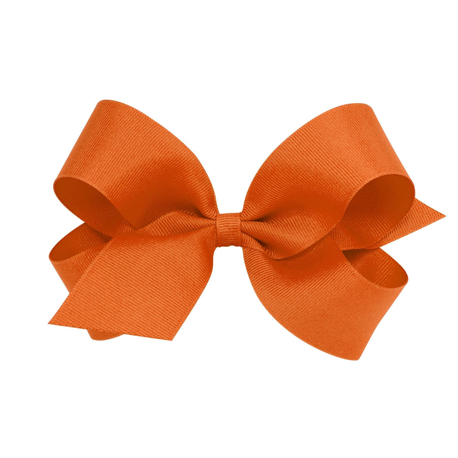 Little English traditional children's clothing. Pumpkin orange hair bow for girls. Classic hair accessory for Fall