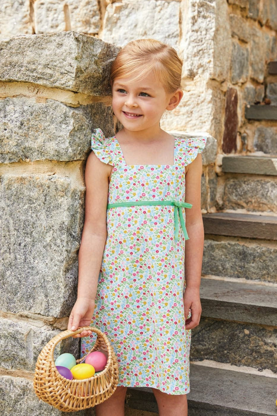 little english girl's dress with floral design and green bow detail and ruffle sleeves