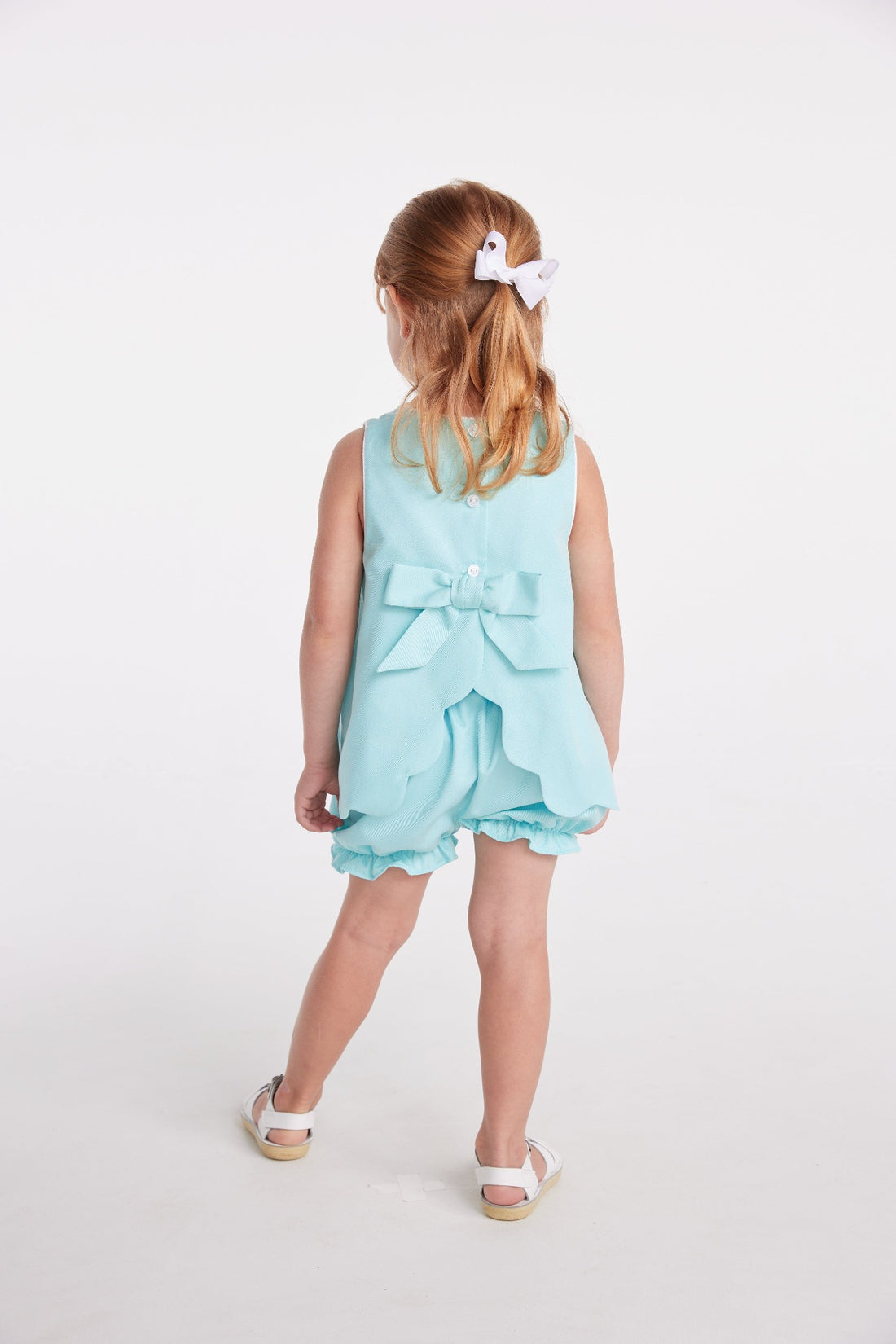 classic childrens clothing girls bloomer set in aqua with bow in the back and applique sailboat on chest