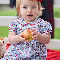 classic baby girl clothes baby girl rommper in blue and red floral print with red piping detail and peter pan collar