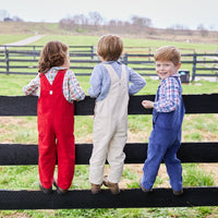 classic childrens clothing overall with brass buttons in red twill color 