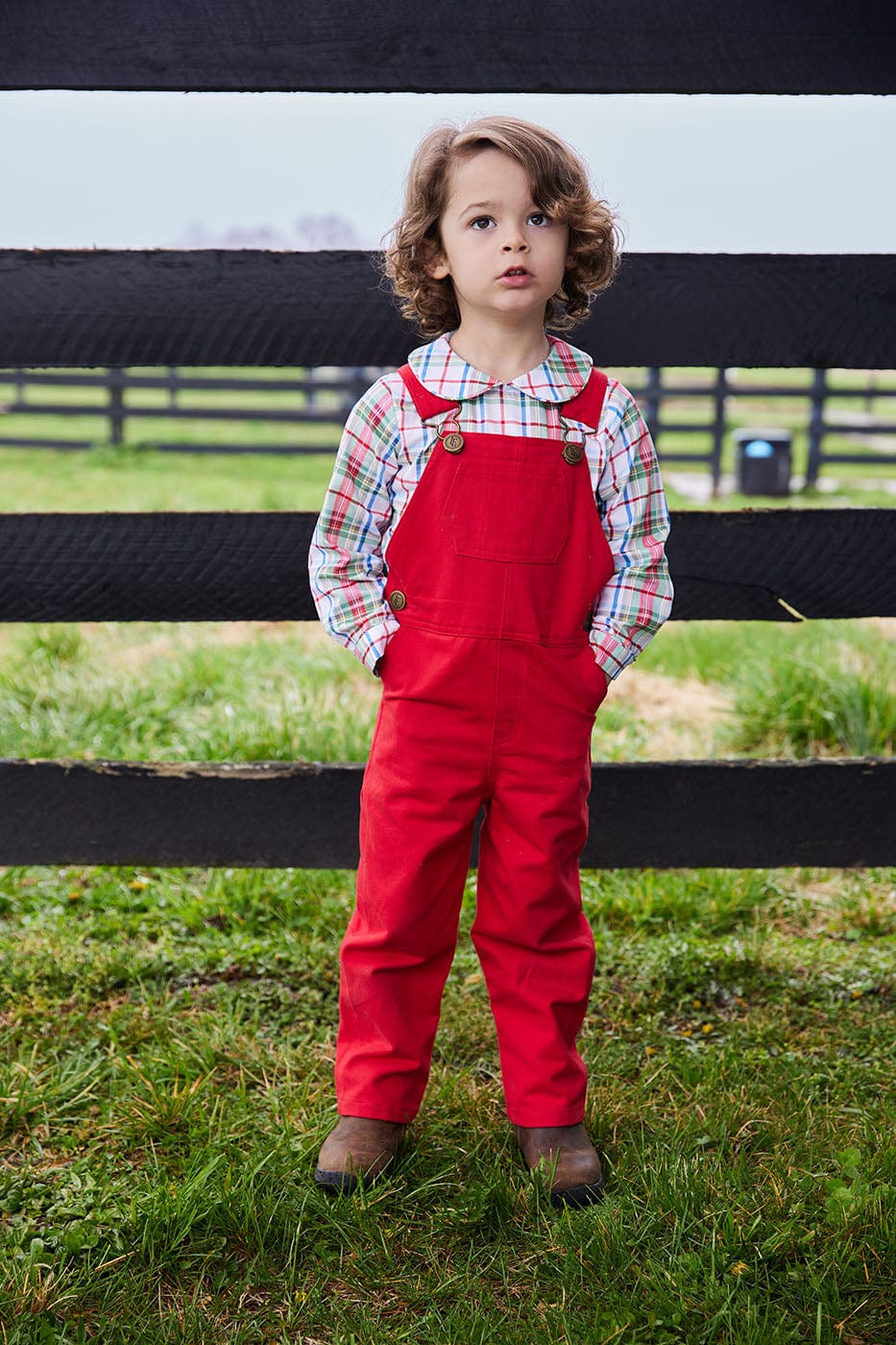 classic childrens clothing overall with brass buttons in red twill color 