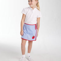 Little English girl's ruffled polo shirt, white knit
