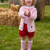 Little English girl's classic clothing, traditional girl's blouse with a red ruffle