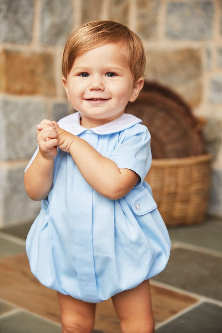 Little English little boy's bubble in light blue with two front white buttons
