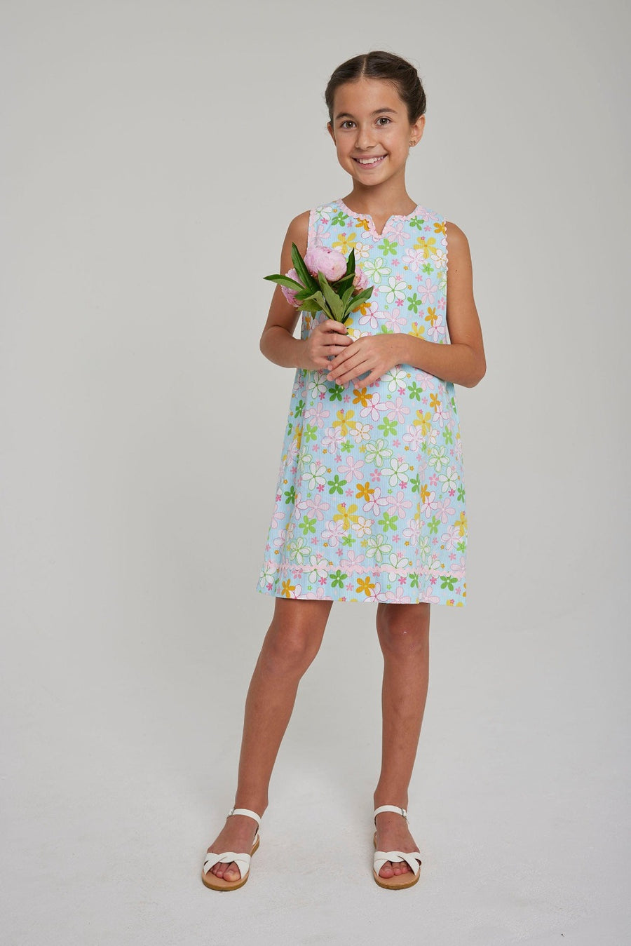 Little English girl's aqua floral shift dress with pink rickrack