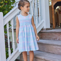 classic childrens clothing girls dress in pink and blue plaid with blue smocking detail